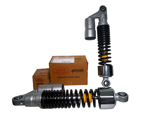Motorcycle shock absorbers with Jawa Yezdi branded boxes on a white background